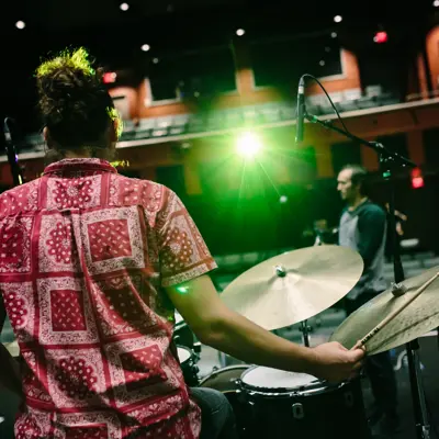 performers on stage inside theatre